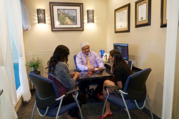 Our Dentist with team at at Designer Smiles, FL