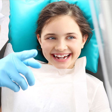 A little girl having dental sealants treatment