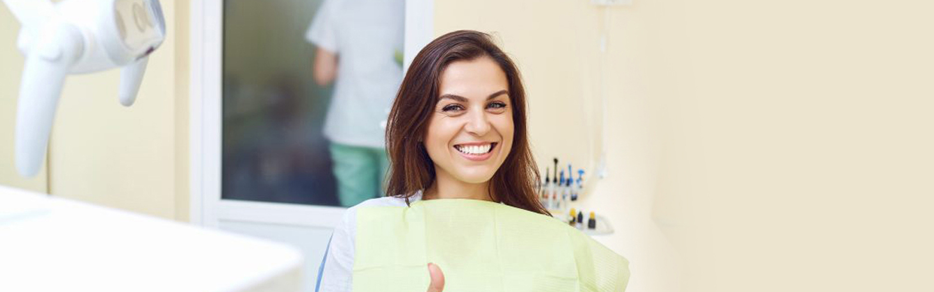 Smiling lady on dentist's chair