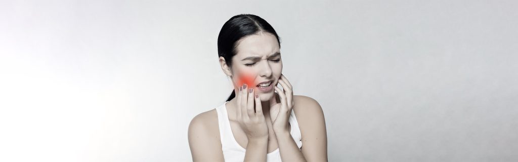 A lady having tooth problem