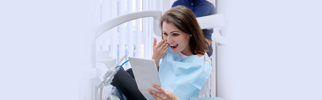 A lady patient happy after a dental treatment