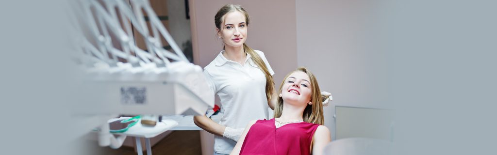A lady having Dental Frenectomy from a dentist